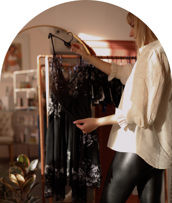 female shopper looking through sleepwear items in Lingerie store in Ledbury 